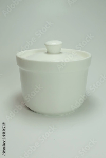 Fototapeta white ceramic container with a white background