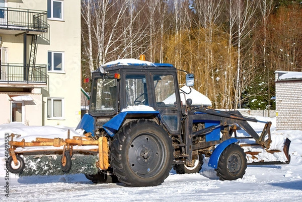 Obraz Tractor with sweeper brush and scraper parked at countryside. Snow removal vehicle parked. Tractor with brush for cleaning roads.
