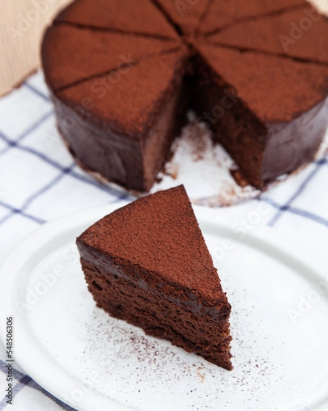 Obraz A slice of classic soft and rich chocolate cake