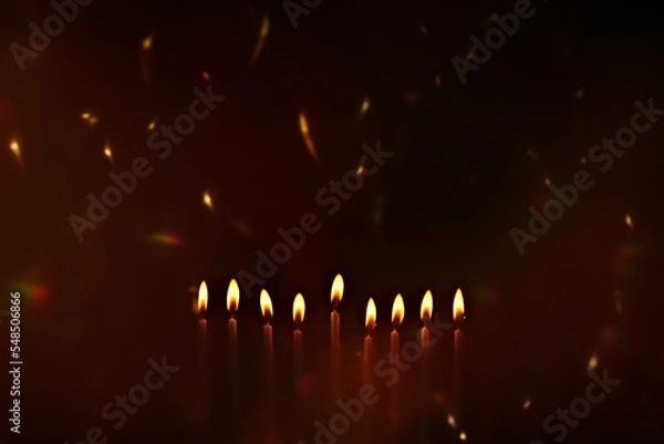 Fototapeta Religious image of Jewish holiday Hanukkah with candles of menorah with sparks from the fire in the air