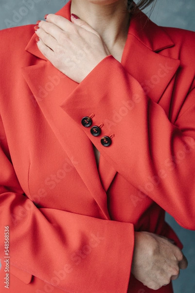 Obraz Woman's hand on a red jacket