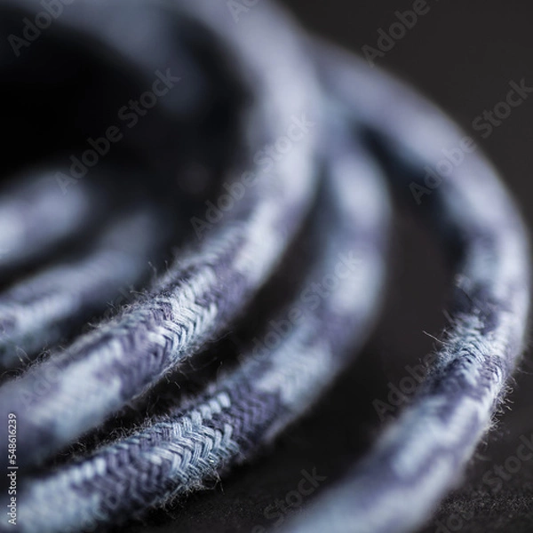 Obraz Blue Grey Braided Cable on Black Background