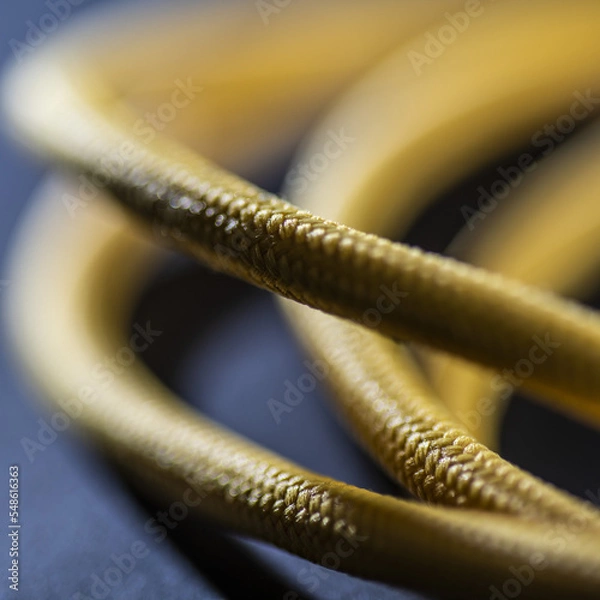 Obraz Yellow Braided Cable on Black Background