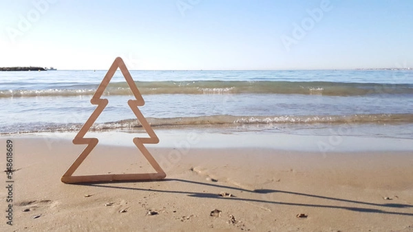 Obraz siluet Christmas tree on the beach on the background of the sea in Spain