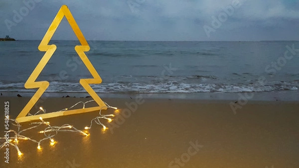 Obraz the outline of a Christmas tree on the beach against the background of the sea