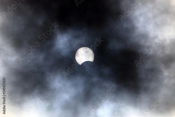Fototapeta Solar eclipse - The Moon partially blocks the Sun from an observer on Earth.