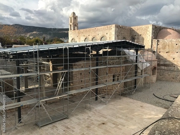 Obraz The Church of St. Nicholas the Wonderworker in under repair  and reconstruction surrounded by scaffolding in Demre, Antalya, Turkey -22 november 2022