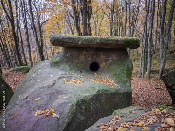 Fototapeta Russia, Caucasus, Tuapse district, dolmen on the mountainside on a cloudy autumn day.