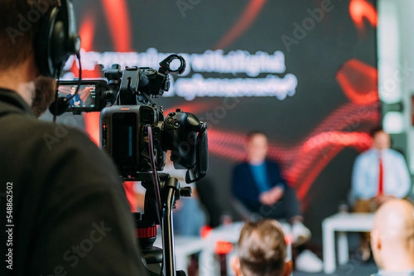 Fototapeta Public Live Event. Television cameras at an IT seminar