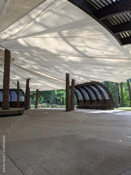 Fototapeta scene in an open-air park with an awning from rain and sun
