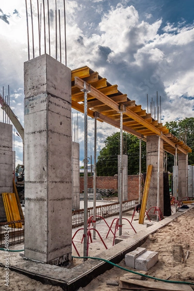 Fototapeta Wooden beam for formwork and concrete columns in housing construction.