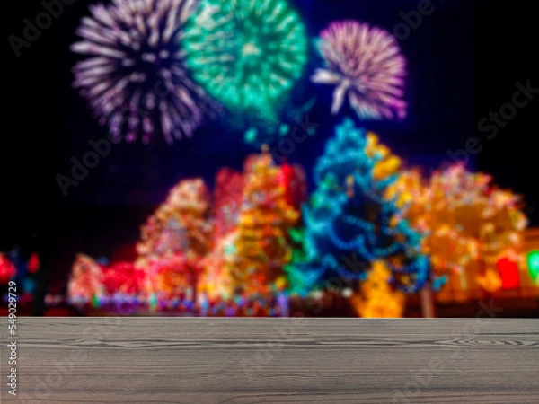 Fototapeta The empty table wooden board in front of the background is blurred. Brown wood perspective in new year's celebration firecrackers -can be used to display or montage your products. Mock up for product 
