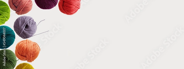 Fototapeta Balls of soft wool colored yarn for hand knitting and crochet on white background. Winter hobby concept. Mock up, flat lay, copy space, banner