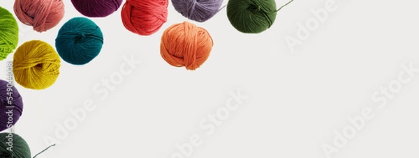Fototapeta Balls of wool colorful yarn for hand knitting and crochet on white background. Winter recomforting hobby concept. Mock up, flat lay, copy space, banner