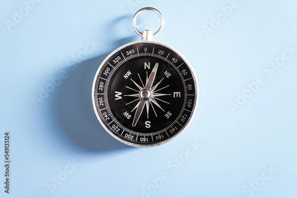 Fototapeta compass on blue background