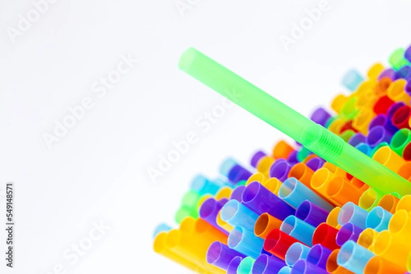 Fototapeta Heap of colorful plastic straws for drinks as background, closeup view macro plastic tubes, Fancy straw multicolor background