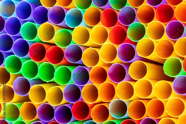 Fototapeta Heap of colorful plastic straws for drinks as background, closeup view macro plastic tubes, Fancy straw multicolor background