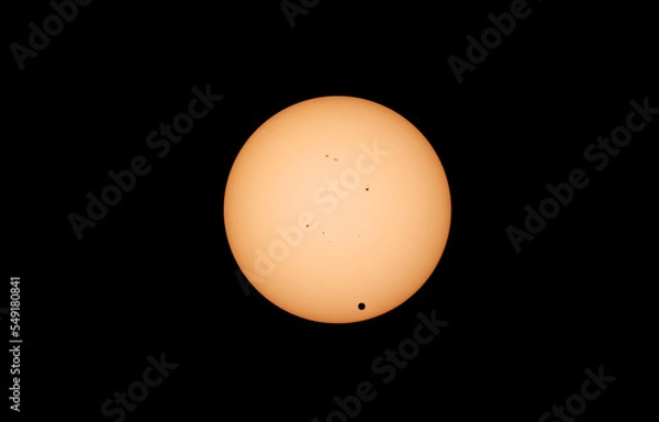 Fototapeta The Transit of Venus in 2012 showing the planet silhouetted against the solar disk with sunspots