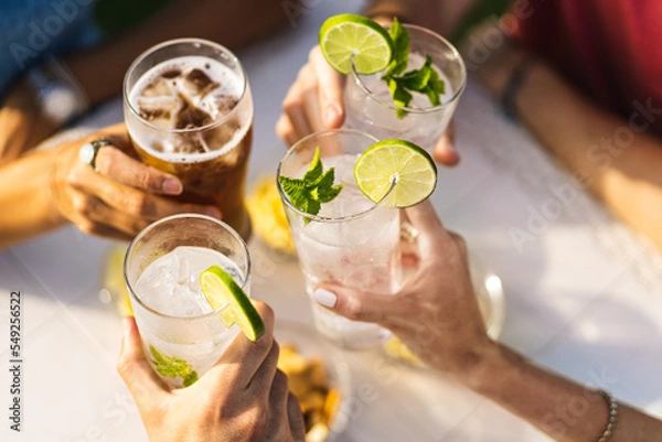 Obraz Diverse business professionals shaking hands in modern office, teamwork concept