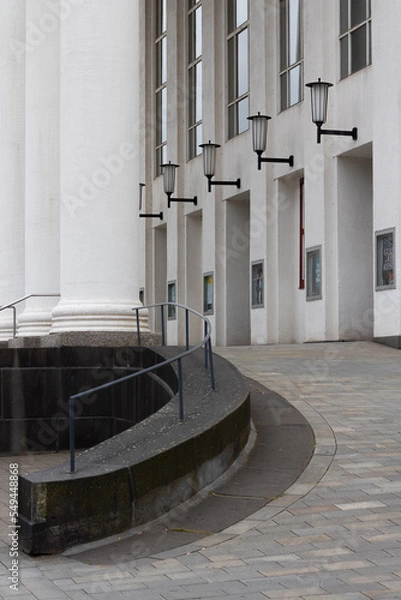 Obraz lamps on building wall with pillar 