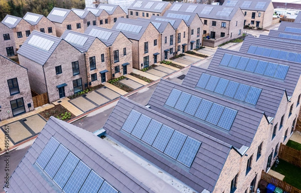 Fototapeta Energy efficient new build modular homes with rooftop solar panels