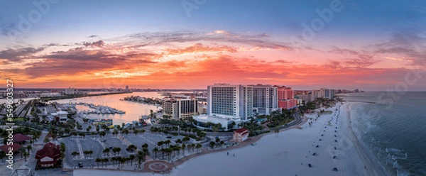 Obraz Row of hotels line Clearwater beach near Tampa with white sand colorful sunrise sky
