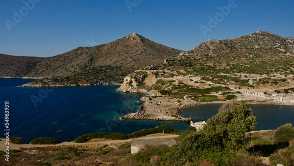 Fototapeta Southwestern tip of Turkey. Sunset from the ancient city of Datça Knidos. Yazikoy village harbor. Ancient Greek city of Knidos. The sky after sunset. Sunlight and shadows. Selective focus close-up.