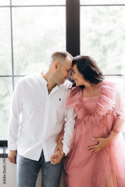 Fototapeta Happy family expecting a baby, concept of support and care