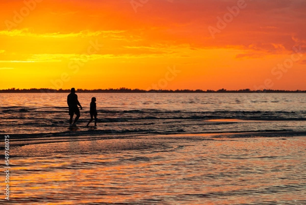 Obraz beach sunset parent child walking