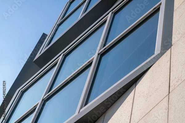 Fototapeta window and mullion on a contemporary modern building. The details of the architecture of the external structure of the facade. windows design