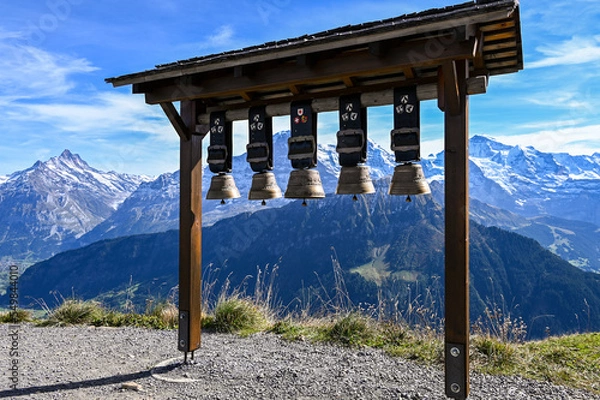 Fototapeta Cow bells at Schynige Platte with a view on the mountain range Eiger Moench Jungfrau