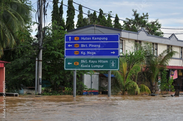 Fototapeta a signboard in a flooded town