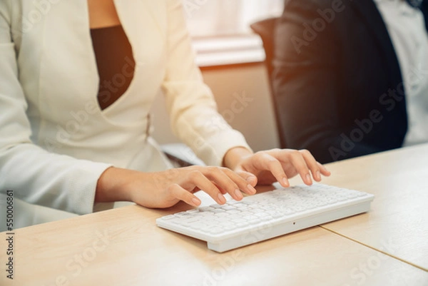 Fototapeta closeup hands of businesswoman working at office, Man typing keyboard on laptop or computer