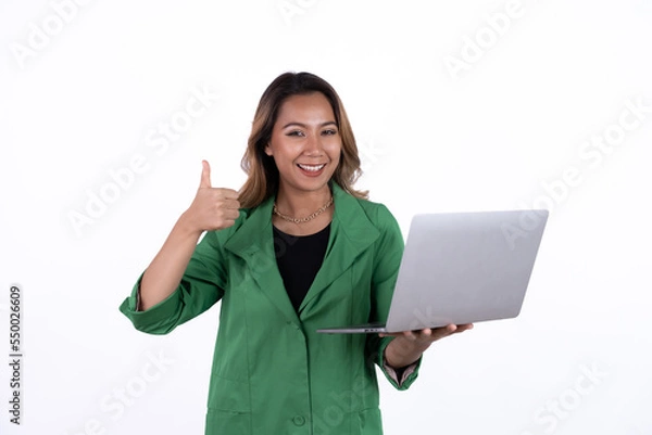 Obraz Business asian woman is holding laptop computer on white Studio background.