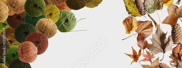 Fototapeta Balls of wool yarn for hand knitting and dry leaves on white background. Autumn mood. Mock up, flat lay, copy space, banner