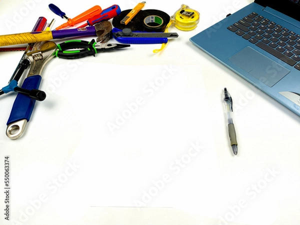 Fototapeta Flat lay, background mockup. The workspace on the desk background is white from the top view. layout room with laptop, handyman equipment and pencil on a white table background.
