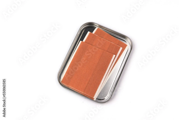 Fototapeta some band-aid isolated on white background with metal box