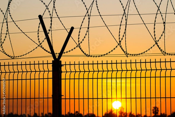 Fototapeta Beautiful landscape, with barbed, Fence Post and Barbed Wire
