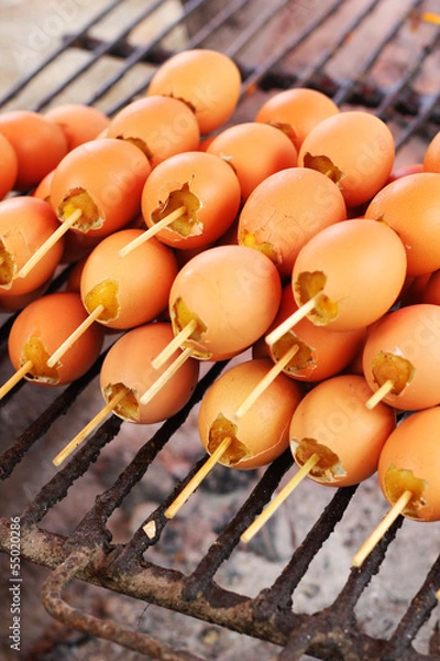 Fototapeta Grilled chicken eggs on the stove.