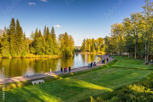Obraz Vyborg, Monrepos Park, tourists on the path of the park opposite Ludwigstein Island. Aerial view.