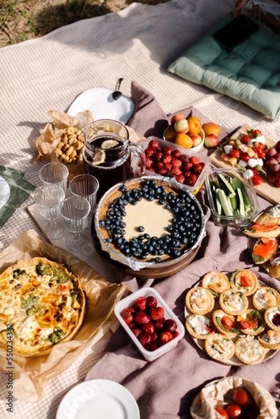 Fototapeta Rest on a picnic with a funeral mood. Picnic food in nature. High quality photo