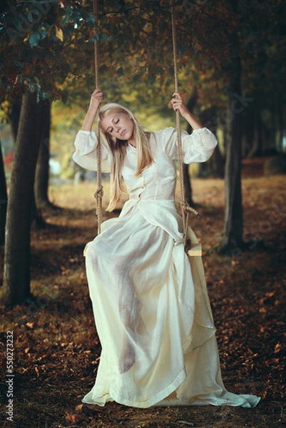 Fototapeta Vintage bride thinking on a swing