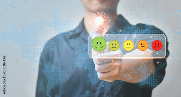 Obraz customer services satisfaction,Businessman pressing smiley face emoticon on virtual touch screen.Customer service experience evaluation concept.