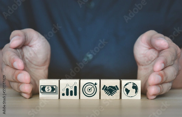 Fototapeta business strategy, Action plan, Goal and target, woods block step on table with icon about business strategy and Action plan. business development concept. wooden cube