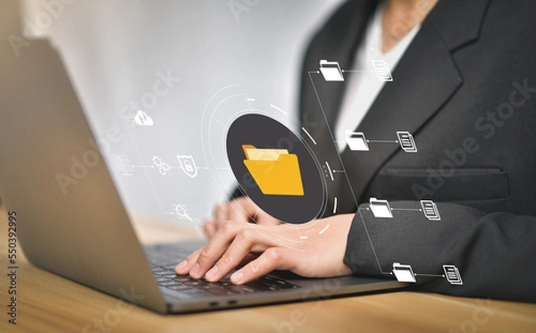 Fototapeta Document Management System (DMS), online documentation database and process automation to efficiently manage files, knowledge and documentation in enterprise with ERP. IT consultant working on laptop