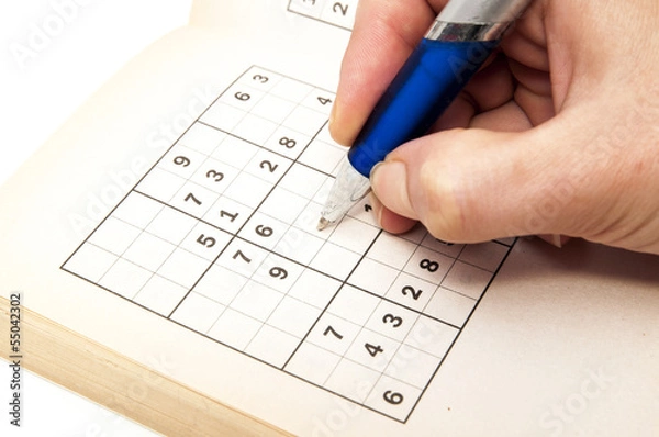 Obraz hand making a sudoku