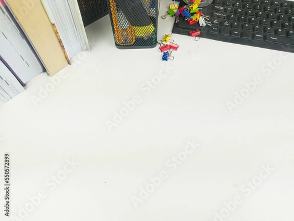 Obraz Flat lay, white desk in the office with layout space.with office equipment such as pencils, notebooks and keyboards at the top.mock up table