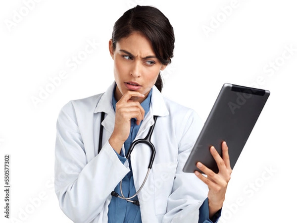 Fototapeta PNG Studio shot of a young doctor using a digital tablet and looking unsure an isolated transparent png background.