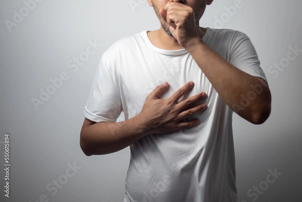 Obraz man wearing white shirt coughing on white background