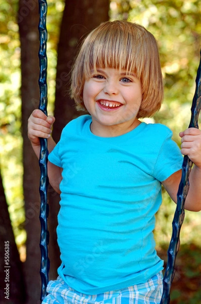 Obraz Little girl playing on a swing